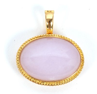 Lot 75 - A lavender jade pendant, the oval lavender...