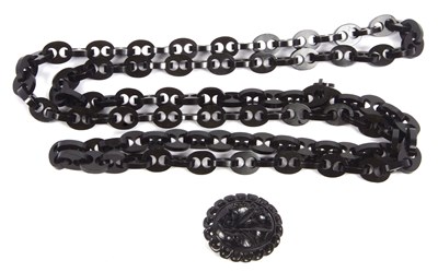 Lot 202 - A jet necklace, with carved lifebuoy style...