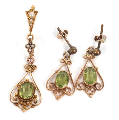 Lot 64 - A peridot pendant and similar earrings, the...