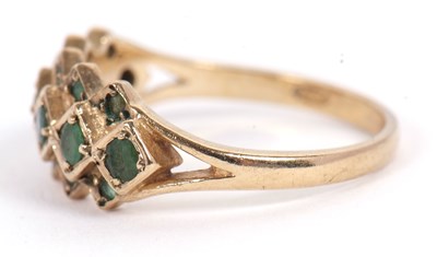 Lot 36 - A 9ct emerald ring, set with a central row of...