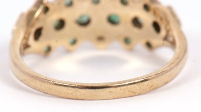 Lot 36 - A 9ct emerald ring, set with a central row of...