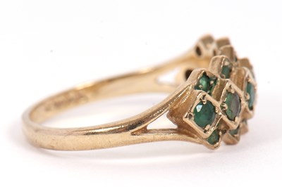 Lot 36 - A 9ct emerald ring, set with a central row of...