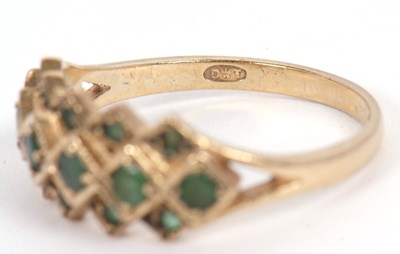 Lot 36 - A 9ct emerald ring, set with a central row of...