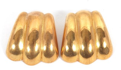 Lot 162 - A pair of gold earclips, with three arced...