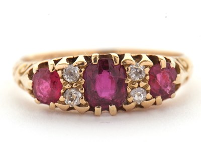 Lot 48 - An 18ct garnet and diamond ring, the three...