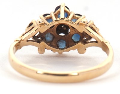 Lot 47 - A 9ct sapphire and diamond ring, with a...