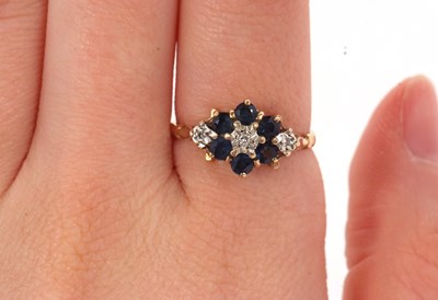 Lot 47 - A 9ct sapphire and diamond ring, with a...