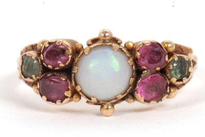 Lot 51 - An opal, garnet and emerald ring, the central...