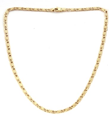 Lot 217 - A 9ct fancy link chain, with looped crossover...