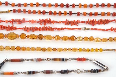 Lot 235 - Four necklaces: to include a faceted agate...