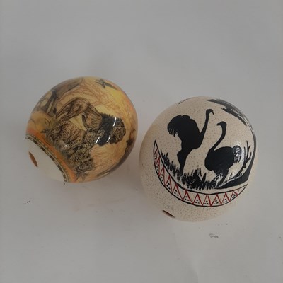 Lot 89 - Two painted Ostrich eggs decorated with...