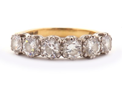 Lot 79 - An 18ct six stone diamond ring, the six round...