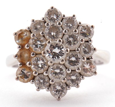 Lot 85 - An 18ct diamond cluster ring, set with round...