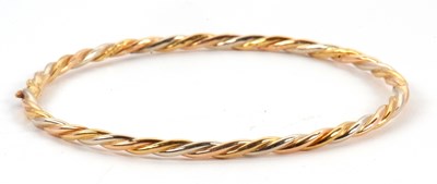 Lot 151 - An 18ct tri-colour bangle, the hinged yellow,...