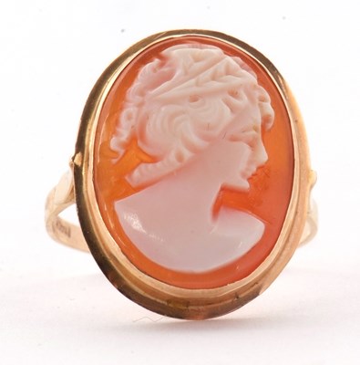 Lot 19 - A cameo ring, the oval shell cameo in collet...