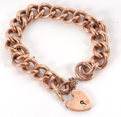 Lot 210 - A 9ct rose gold bracelet, the curblink...