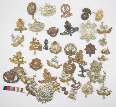 Lot 41 - Quantity of 20th century British army cap...