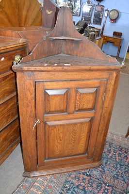 Lot 459 - A 19th Century oak wall mounted corner cabinet...