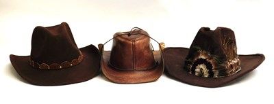 Lot 157 - Three cowboy hats, to include a brown leather...