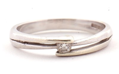 Lot 27 - A 9ct diamond ring, the central round...