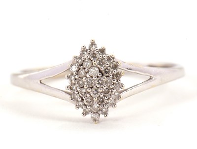 Lot 2 - A diamond cluster ring, the marquise shape...