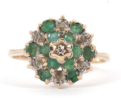 Lot 4 - A 9ct emerald and diamond cluster ring, set...