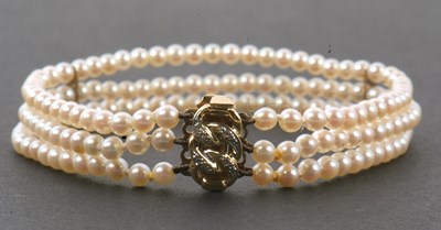 Lot 126 - A cultured pearl and diamond bracelet by...