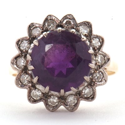 Lot 84 - An 18ct amethyst and diamond ring, the round...