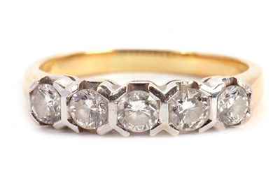 Lot 63 - A five stone diamond ring, the five round...