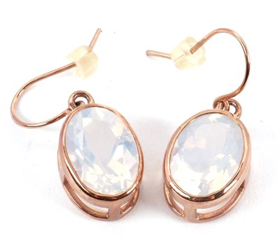 Lot 148 - A pair of rose gold and quartz earrings, the...
