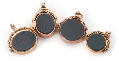Lot 189 - Four hardstone fobs: to include a round...