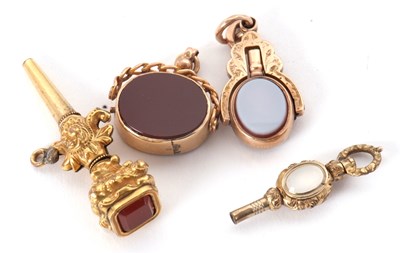 Lot 191 - A rotating hardstone watch key-fob, stamped...