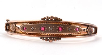 Lot 122 - An Edwardian ruby and diamond bangle, the...