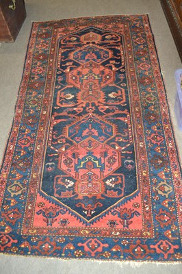 Lot 572 - A 20th Century Caucasian wool rug decorated...