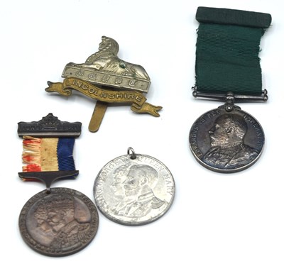 Lot 18 - ERVII Volunteer long service medal impressed...