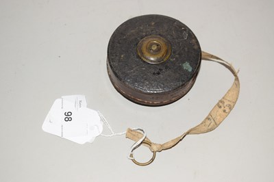 Lot 98 - A vintage winding leather case tape measure