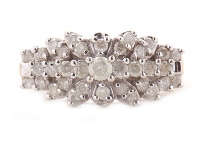 Lot 69 - A 9ct diamond cluster ring, set throughout...
