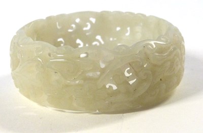Lot 207 - A jade type carved bangle