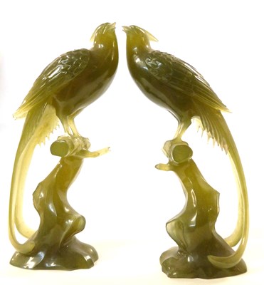 Lot 236 - A pair of jade style carved birds, 19cm high