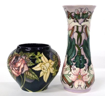 Lot 259 - A Moorcroft vase with tubelined floral design...