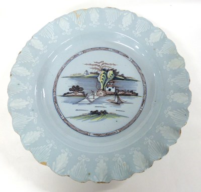 Lot 266 - A large Bristol Delft dish with polychrome and...