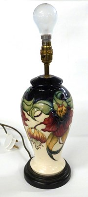 Lot 272 - A Moorcroft lamp base with tubelined floral...