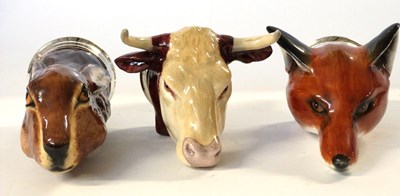 Lot 345 - Group of three porcelain stirrup cups with...