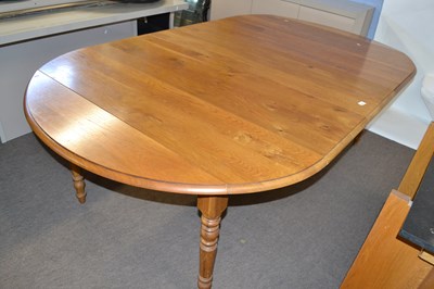 Lot 441 - 20th Century oak dining table raised on turned...