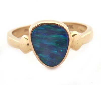 Lot 38 - A 14ct opal doublet ring, the asymetric opal...