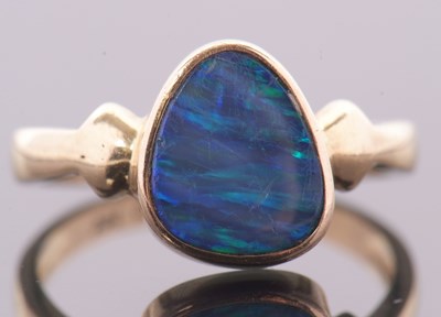Lot 38 - A 14ct opal doublet ring, the asymetric opal...
