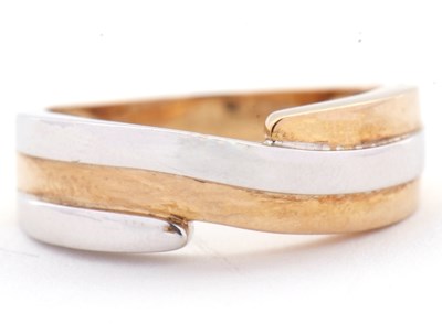 Lot 41 - A 9ct two tone crossover ring, the white and...