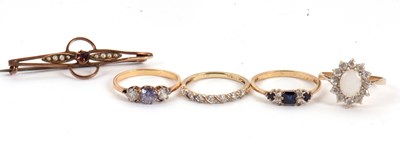 Lot 125 - Four gemset rings and a brooch: to include a...