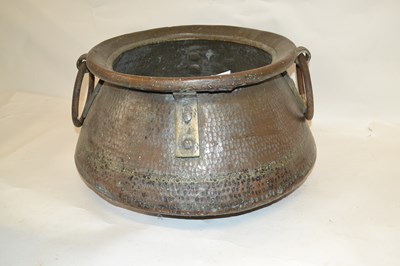 Lot 543 - A large Far Eastern hammered copper jardiniere...