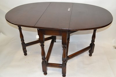 Lot 498 - 20th Century oak gate leg table on turned legs,...